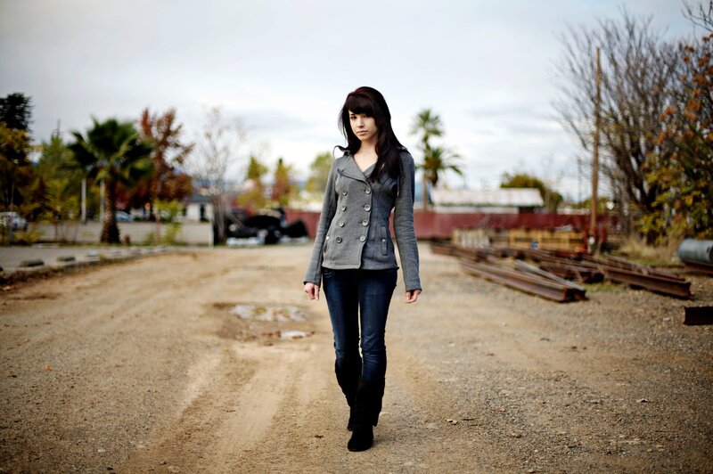 woman walking on a dirt path