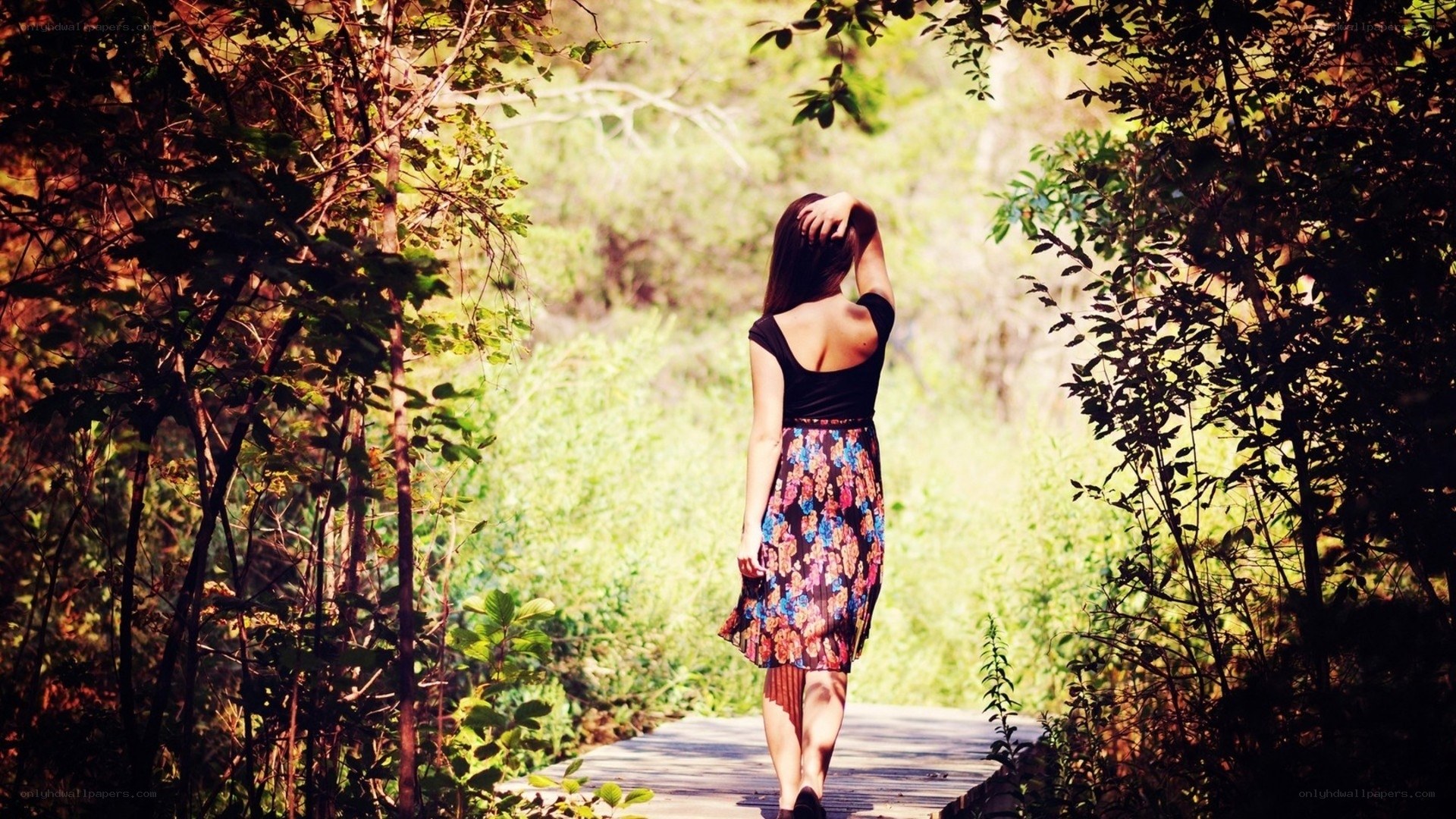 Woman walking on a forest path