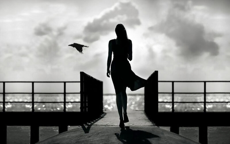 woman walking on a pier