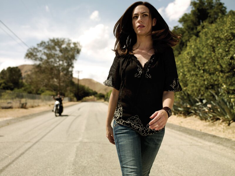 woman walking on a road