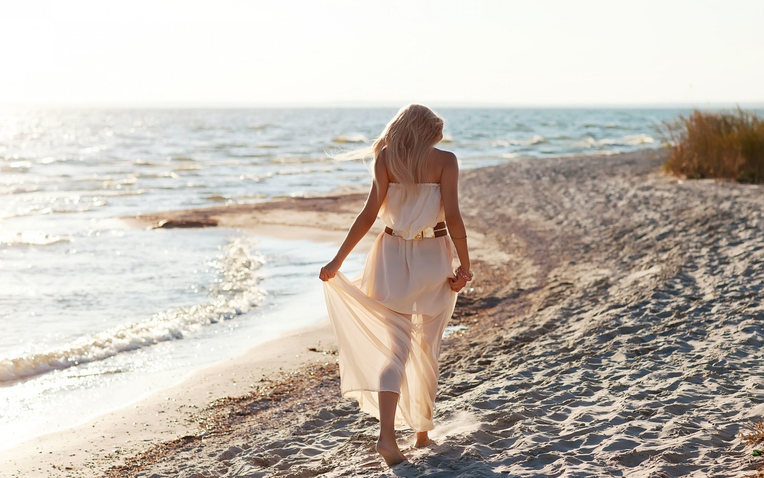 woman walking on beach