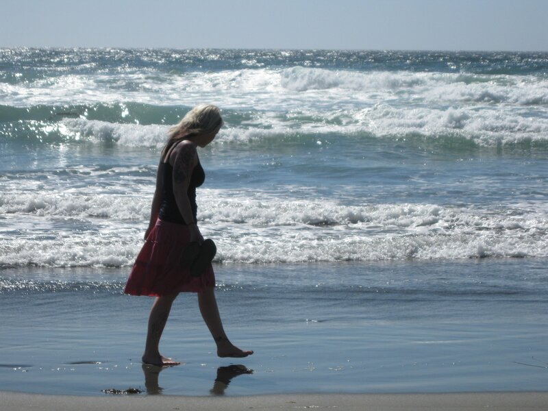 Woman walking on beach