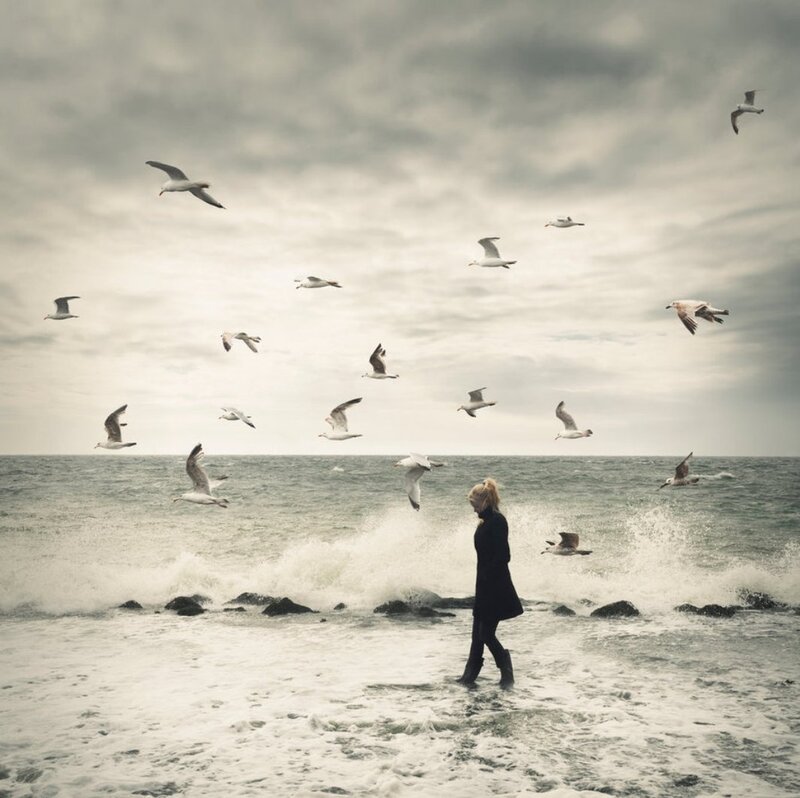 Woman Walking on Beach — Gray, Dramatic