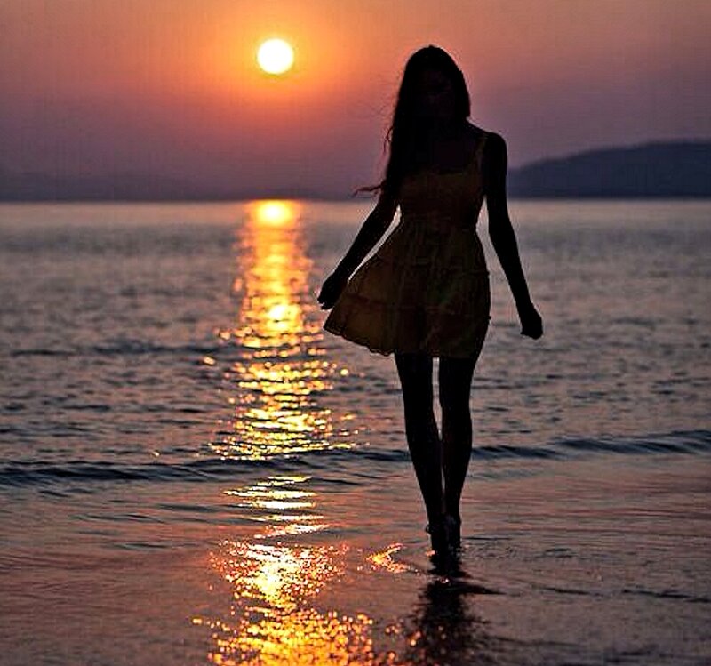 Woman Walking on Beach — Orange, Serene