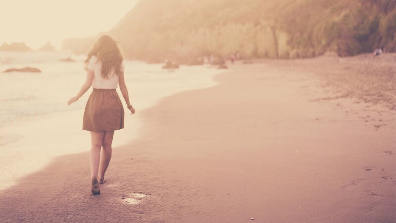 Woman Walking on Beach — Pink