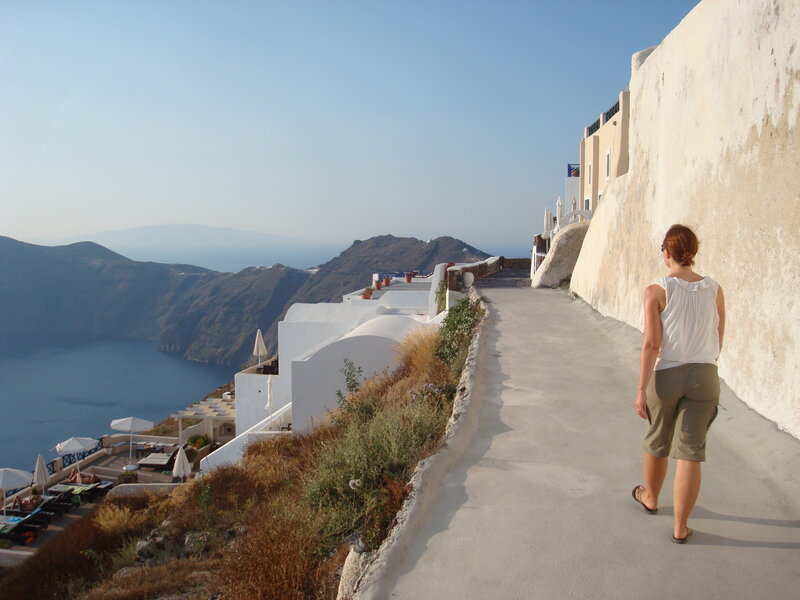 Woman Walking on Cliff Path