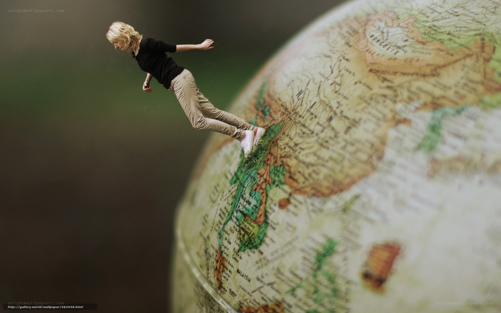 woman walking on globe