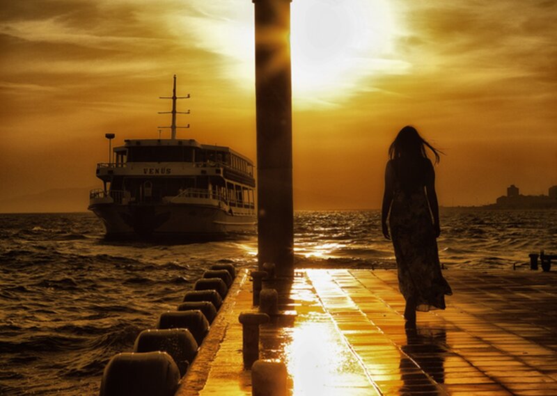 Woman Walking on Pier — Gold