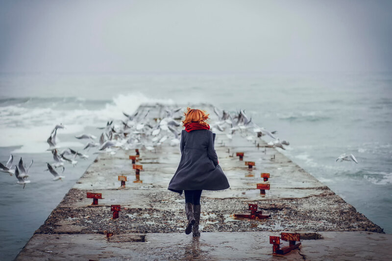 Woman Walking on Pier — Gray