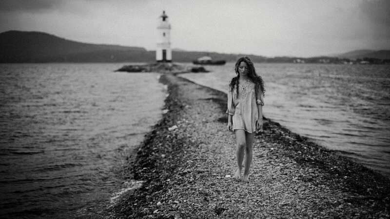 Woman Walking on Pier