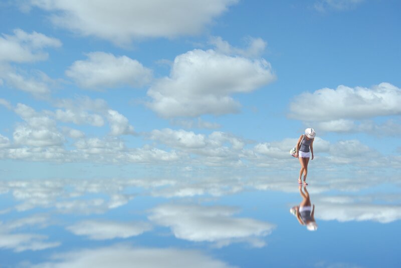 Woman Walking on Reflective Surface
