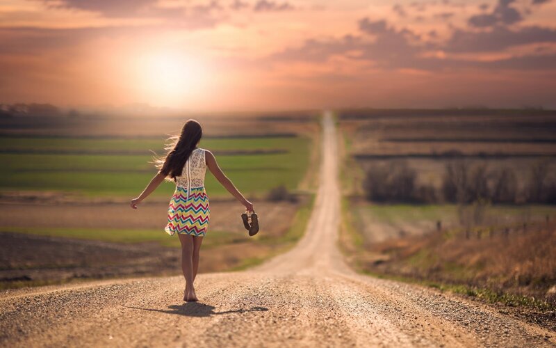 Woman Walking on Road — Orange, Serene, Sunset