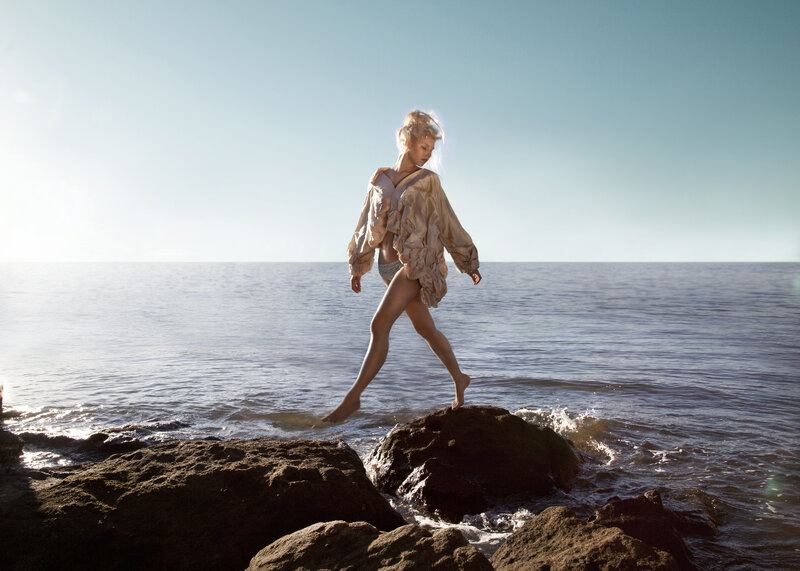 Woman Walking on Rocks