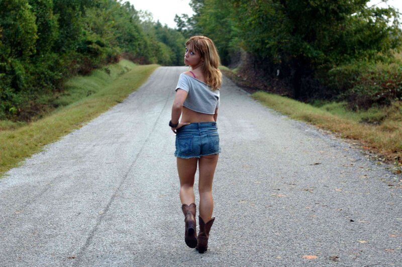 woman walking on rural road