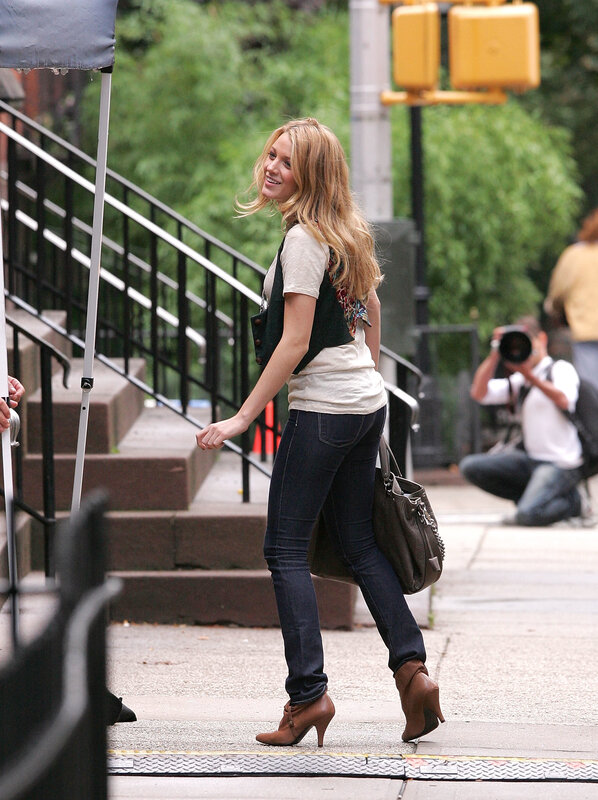 woman walking on sidewalk