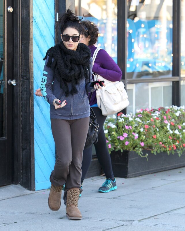 Woman walking on sidewalk