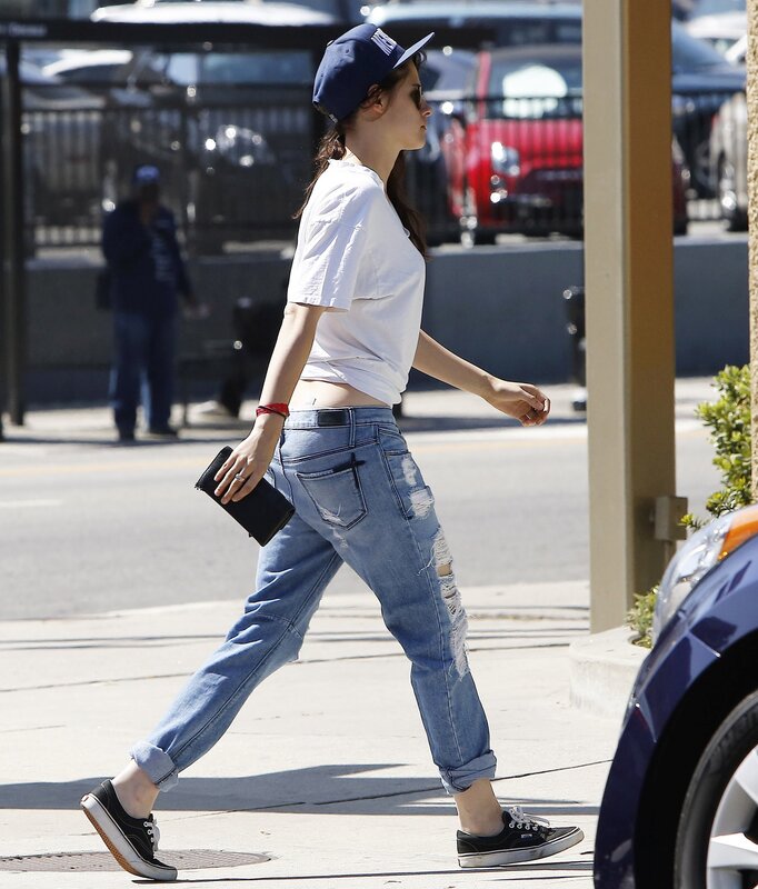 woman walking on sidewalk
