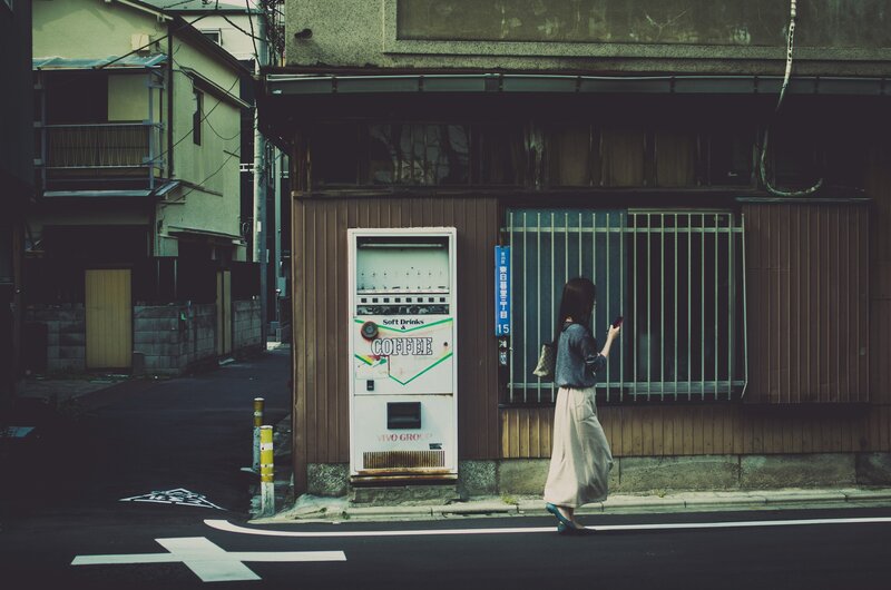 Woman Walking on Street — Brown, Calm