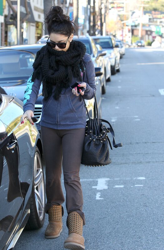 woman walking on street with car