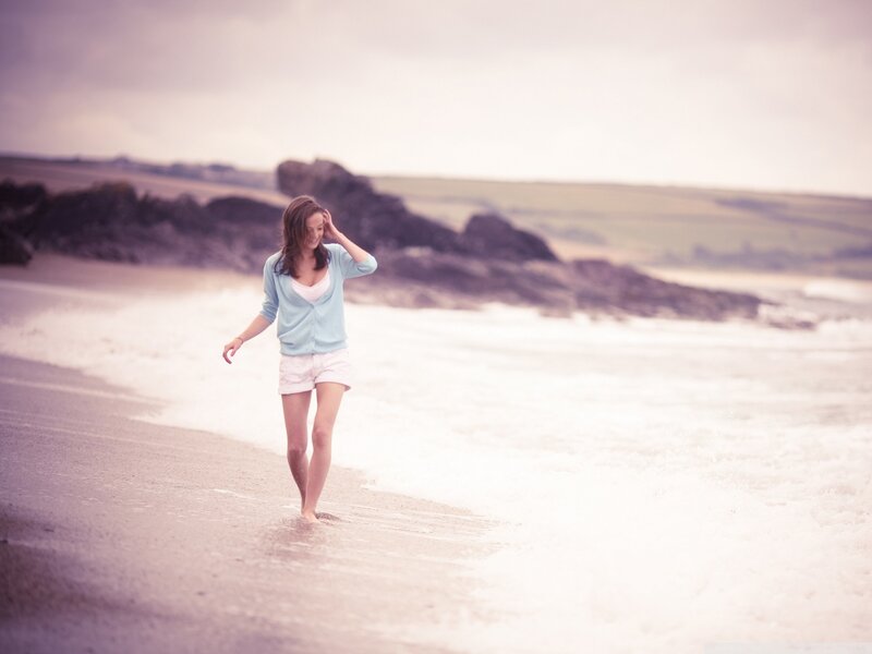 Woman walking on the beach