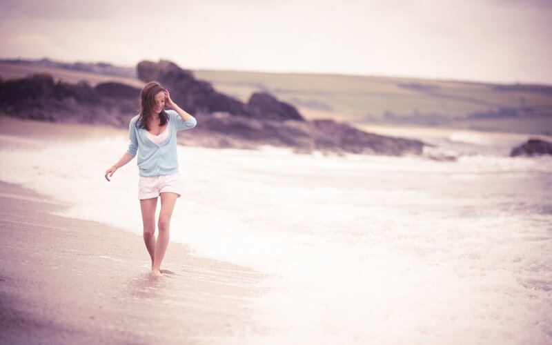 Woman walking on the beach