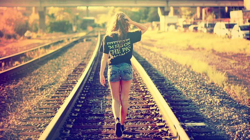 Woman Walking on Train Tracks — Yellow