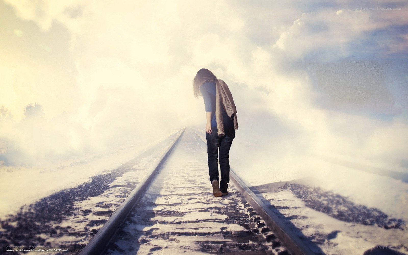 woman walking on train tracks