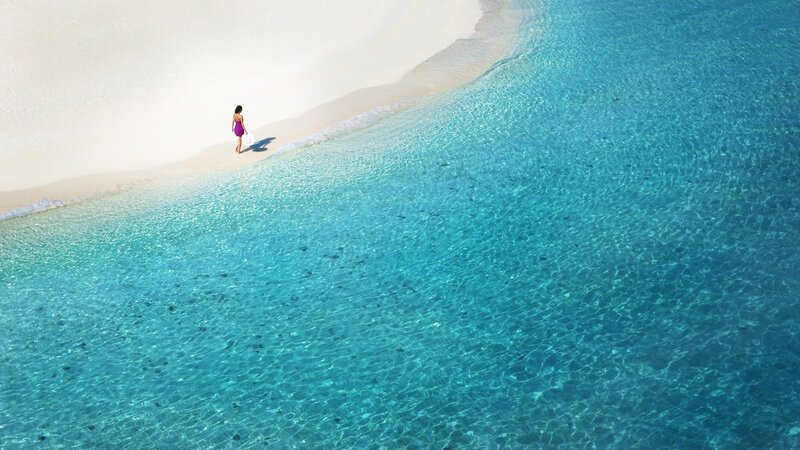 woman walking on tropical beach