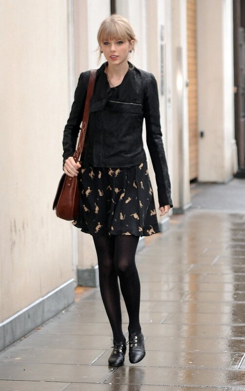 woman walking on wet street