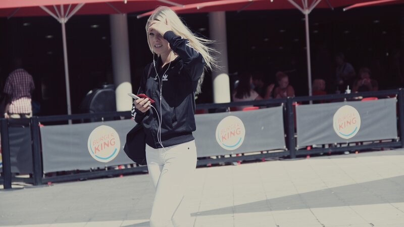 Woman walking outside Burger King