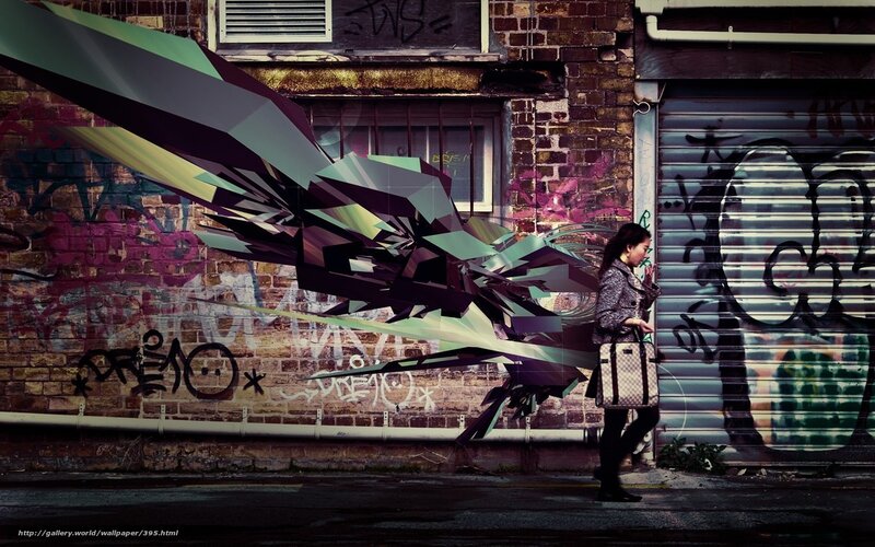 Woman walking past graffiti art