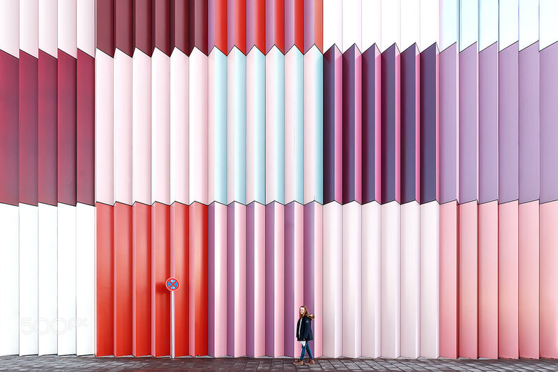 Woman Walking Past Wall