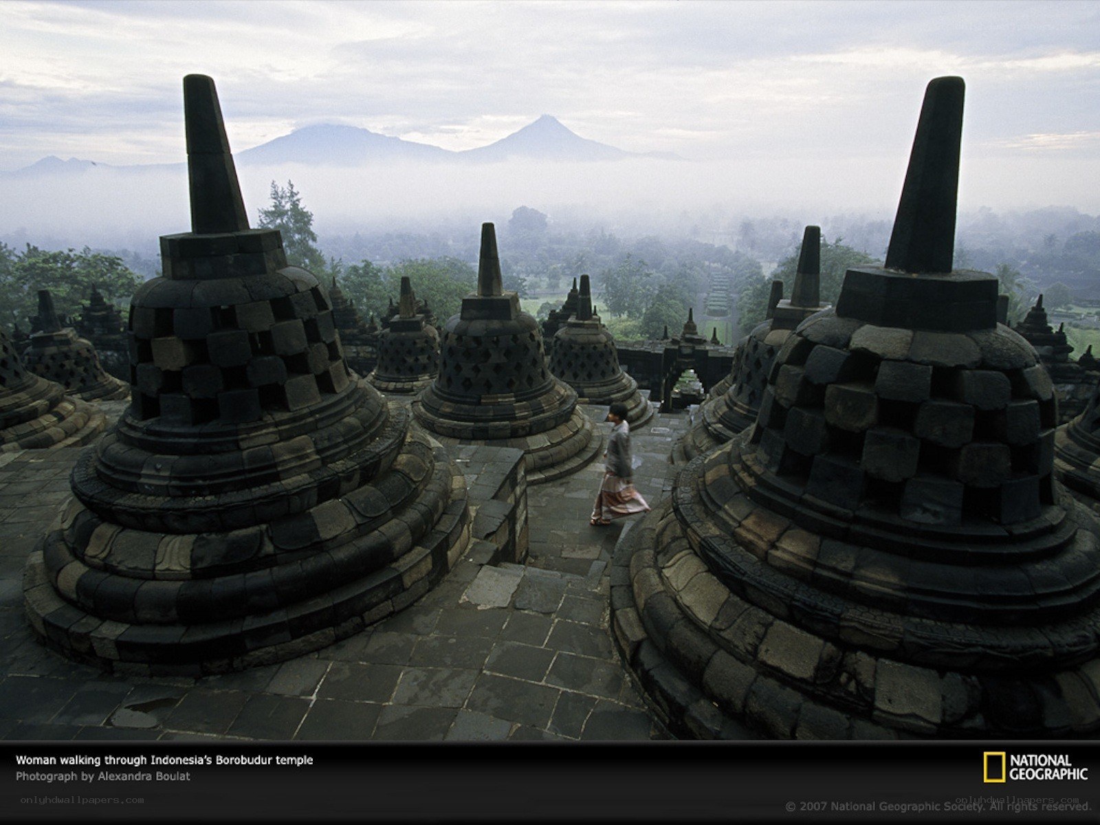 Woman walking through Borobudur temple