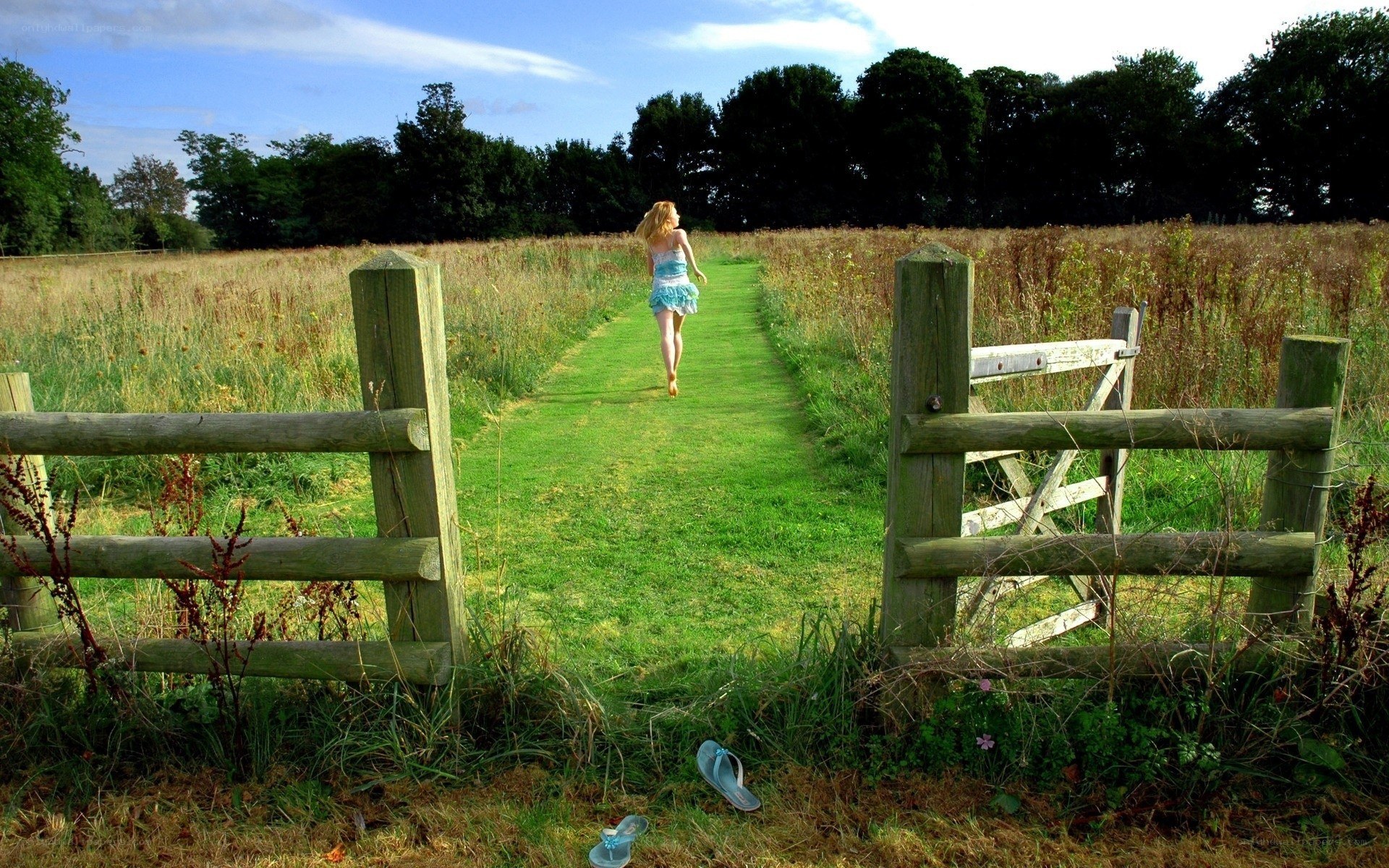 Woman walking through field