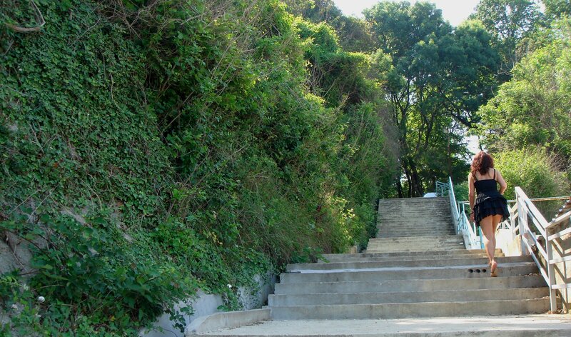 Woman walking up outdoor stairs
