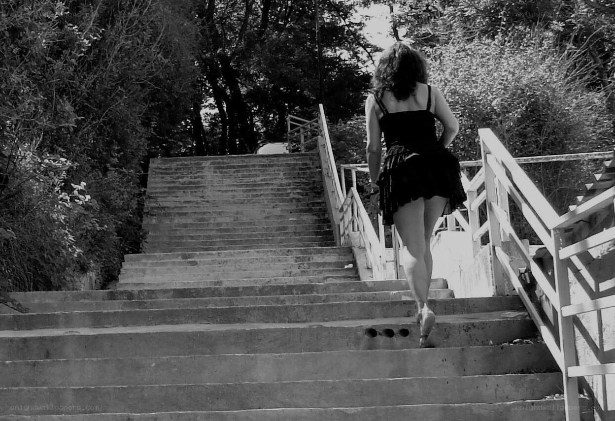 woman walking up stairs