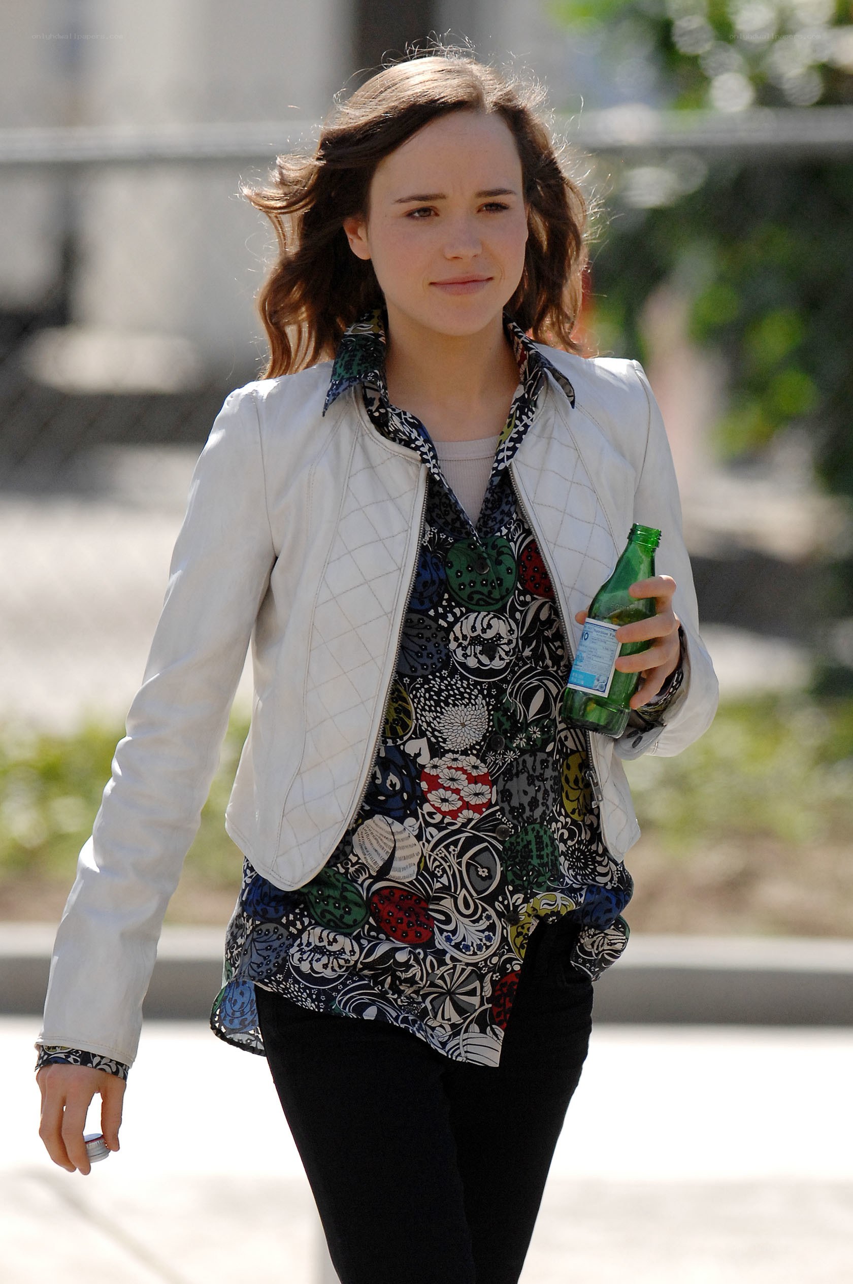 woman walking with bottle