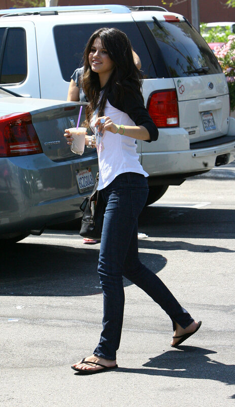 woman walking with drink