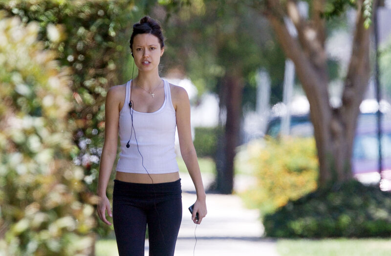woman walking with earphones