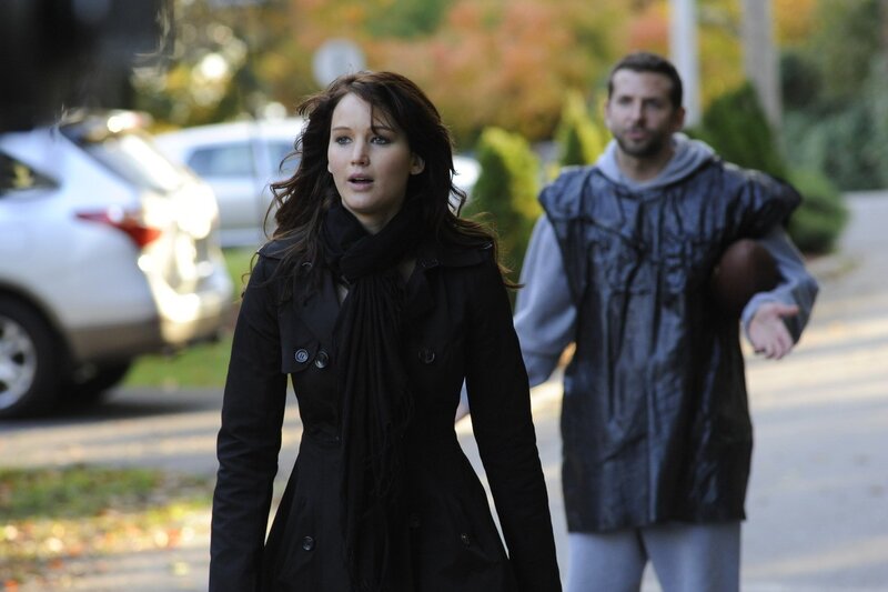 woman walking with man in background