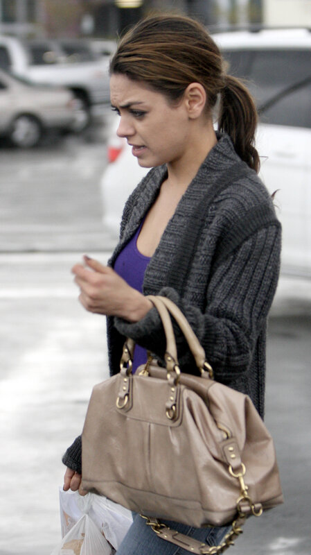 woman walking with purse