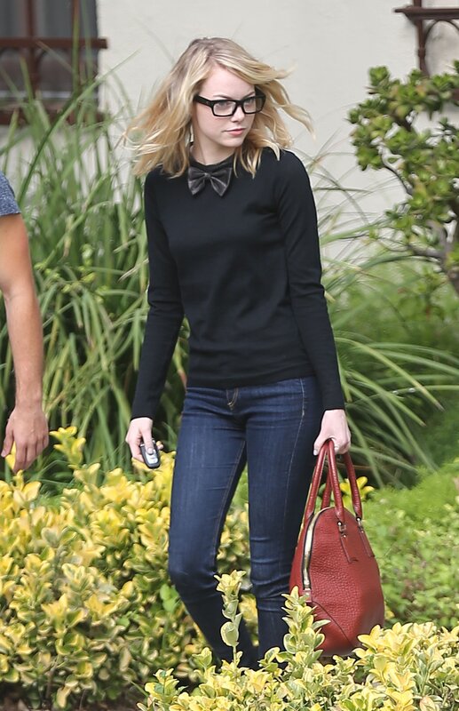 woman walking with red bag