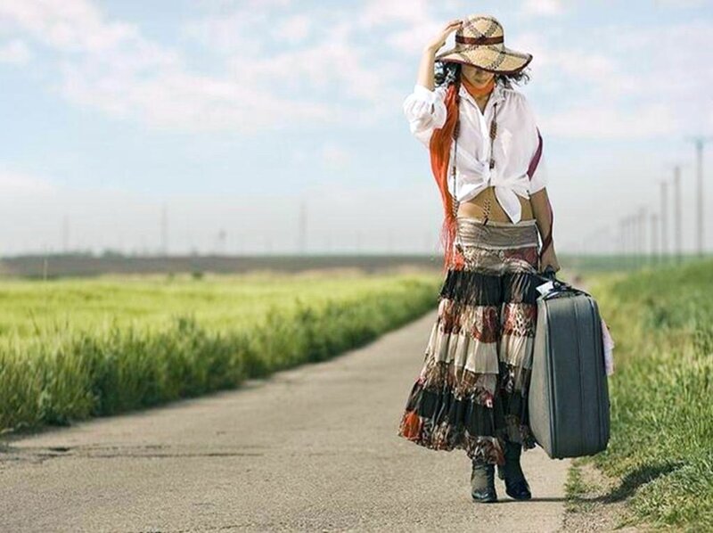 woman walking with suitcase