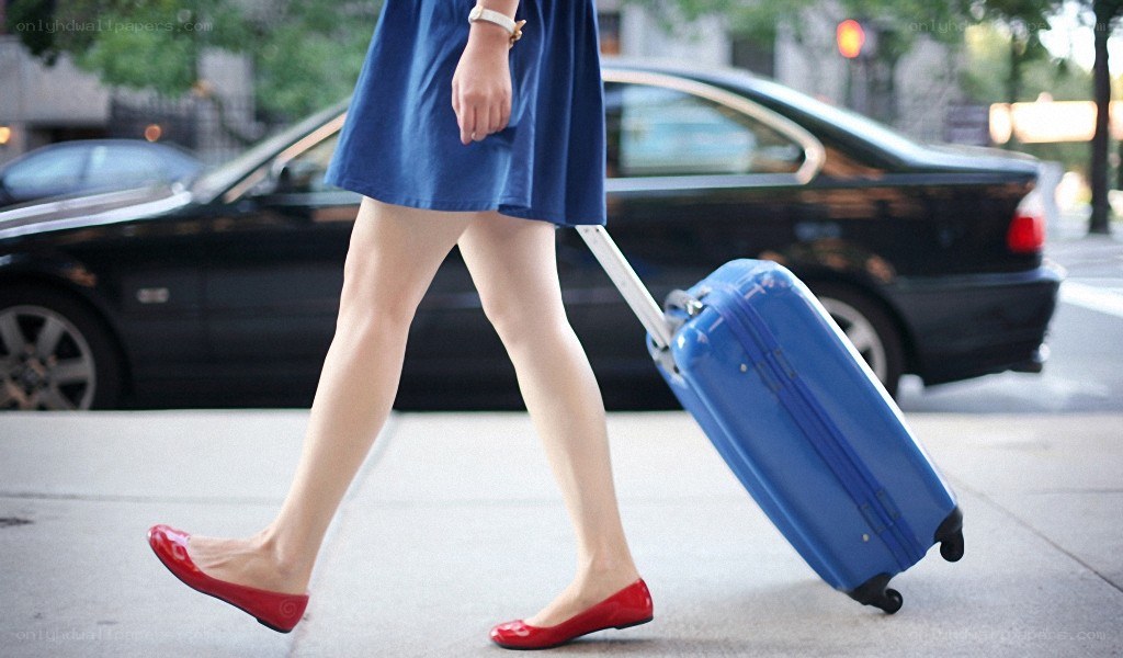 woman walking with suitcase