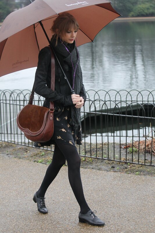 Woman walking with umbrella