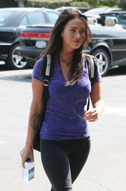 woman walking with water bottle