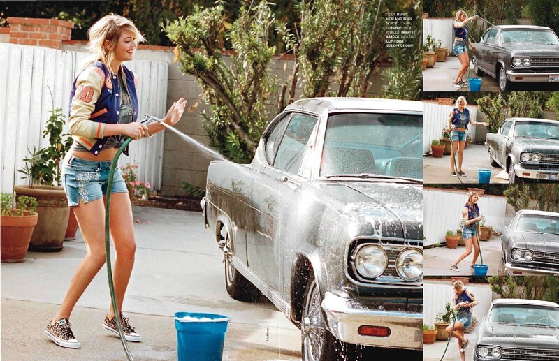 Woman washing a classic car