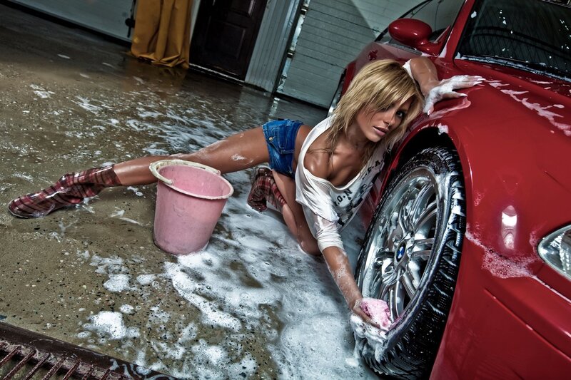 woman washing red car