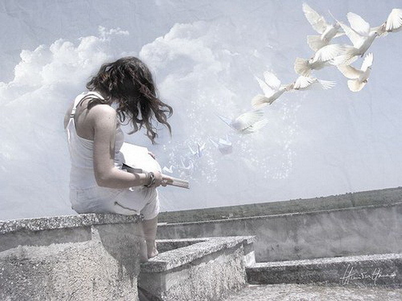 woman watching doves fly
