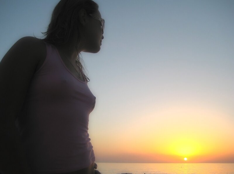 woman watching sunset at beach